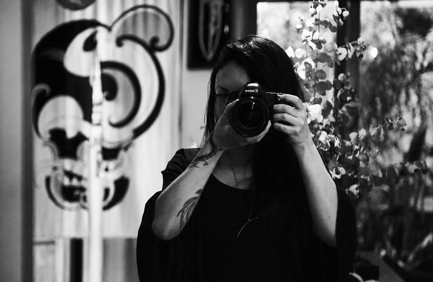 Luiza Prado, Creative Lead, holding a camera